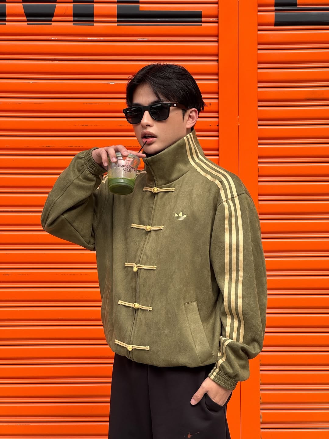 Adidas CNY Jacket Olive Green side profile – mandarin collar and knot button toggle closeup