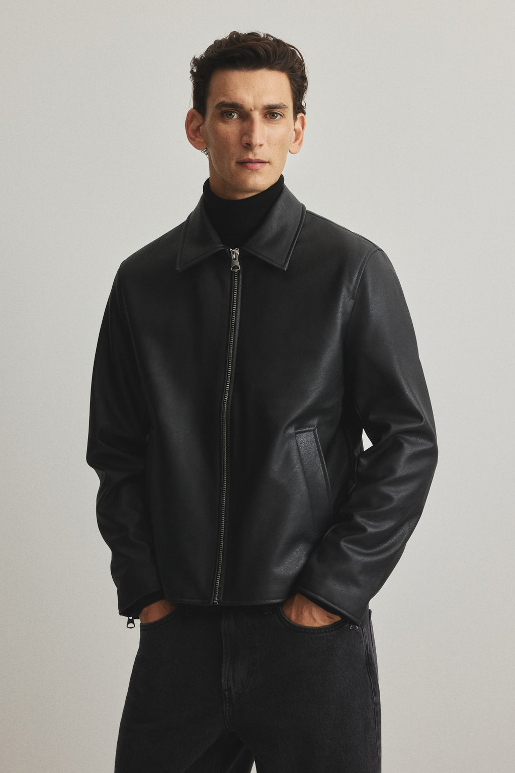 Black boxy leather jacket India – unisex front view premium faux leather streetwear | LZRUS