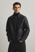 Black boxy leather jacket India – unisex front view premium faux leather streetwear | LZRUS