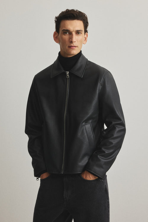 Black boxy leather jacket India – unisex front view premium faux leather streetwear | LZRUS