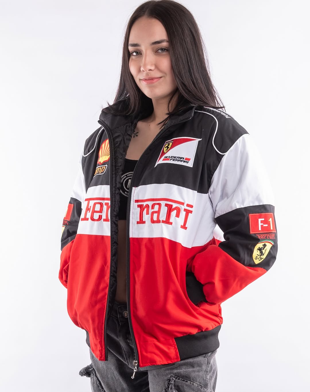 Person wearing a Ferrari Racing Jacket Women – Full Body Look with various logos on a white background