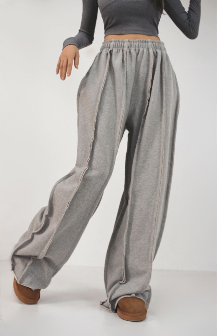 LZRUS exposed seam sweatpants women – close-up waist-down view showing visible raw seam lines, elastic waistband and raw edge hem detail India streetwear