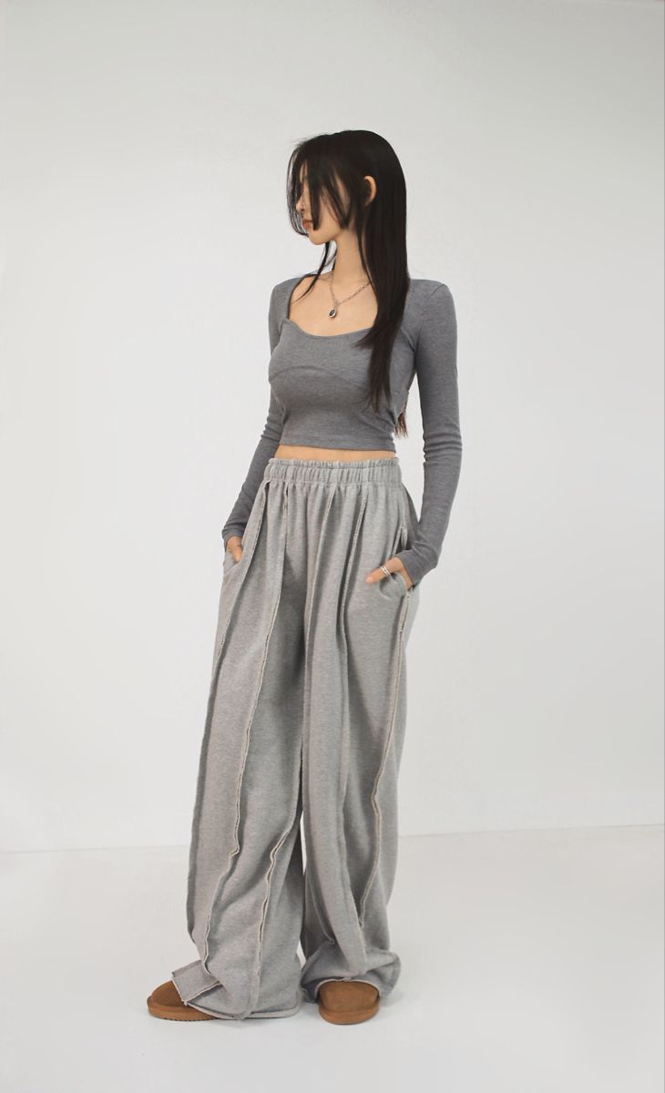 LZRUS exposed seam sweatpants women – full body side pose in grey wide leg deconstructed streetwear sweatpants styled with crop top India