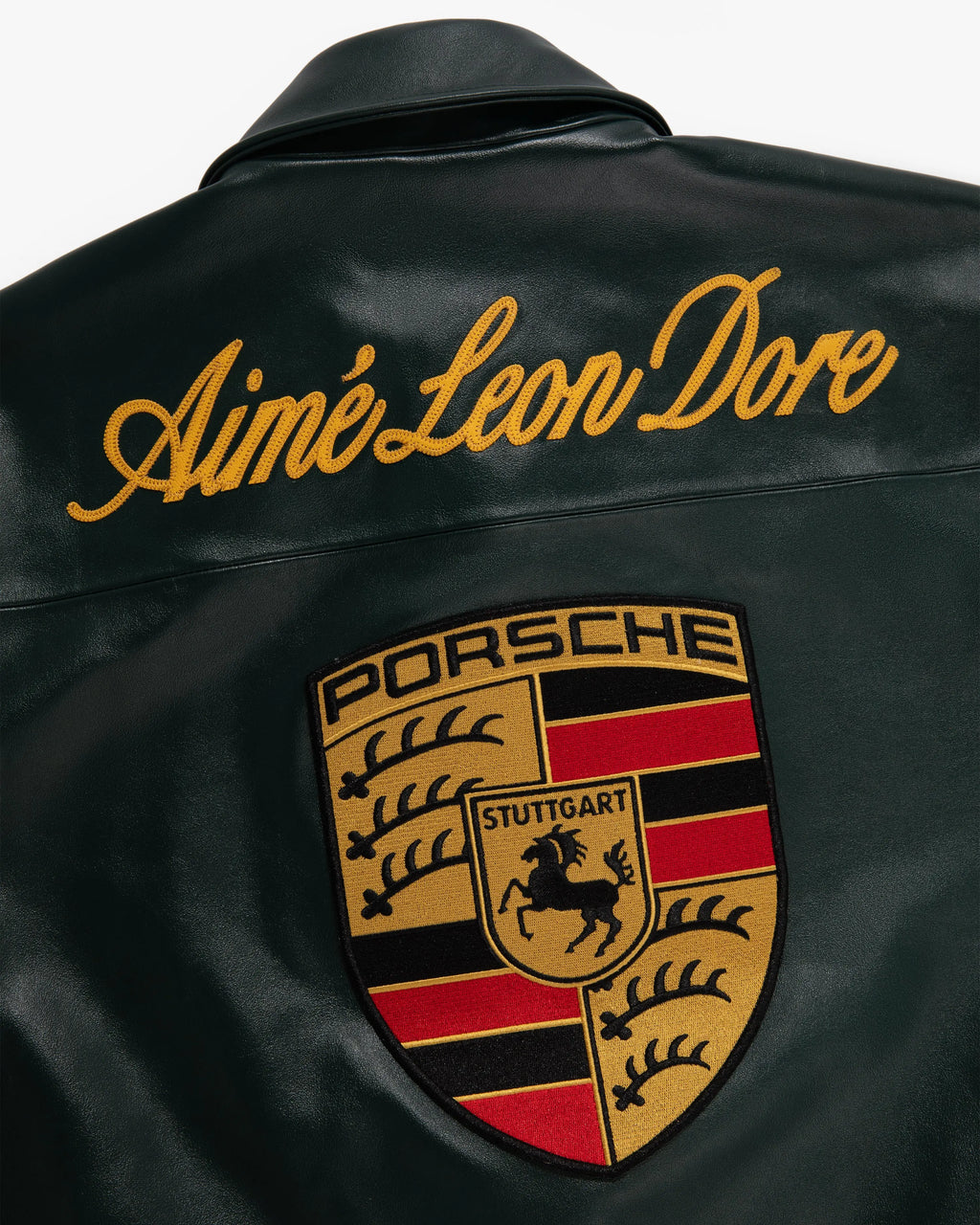 Back design of Porsche 993 turbo leather jacket with racing patches with 'Aime Leon Dore' and Porsche logo