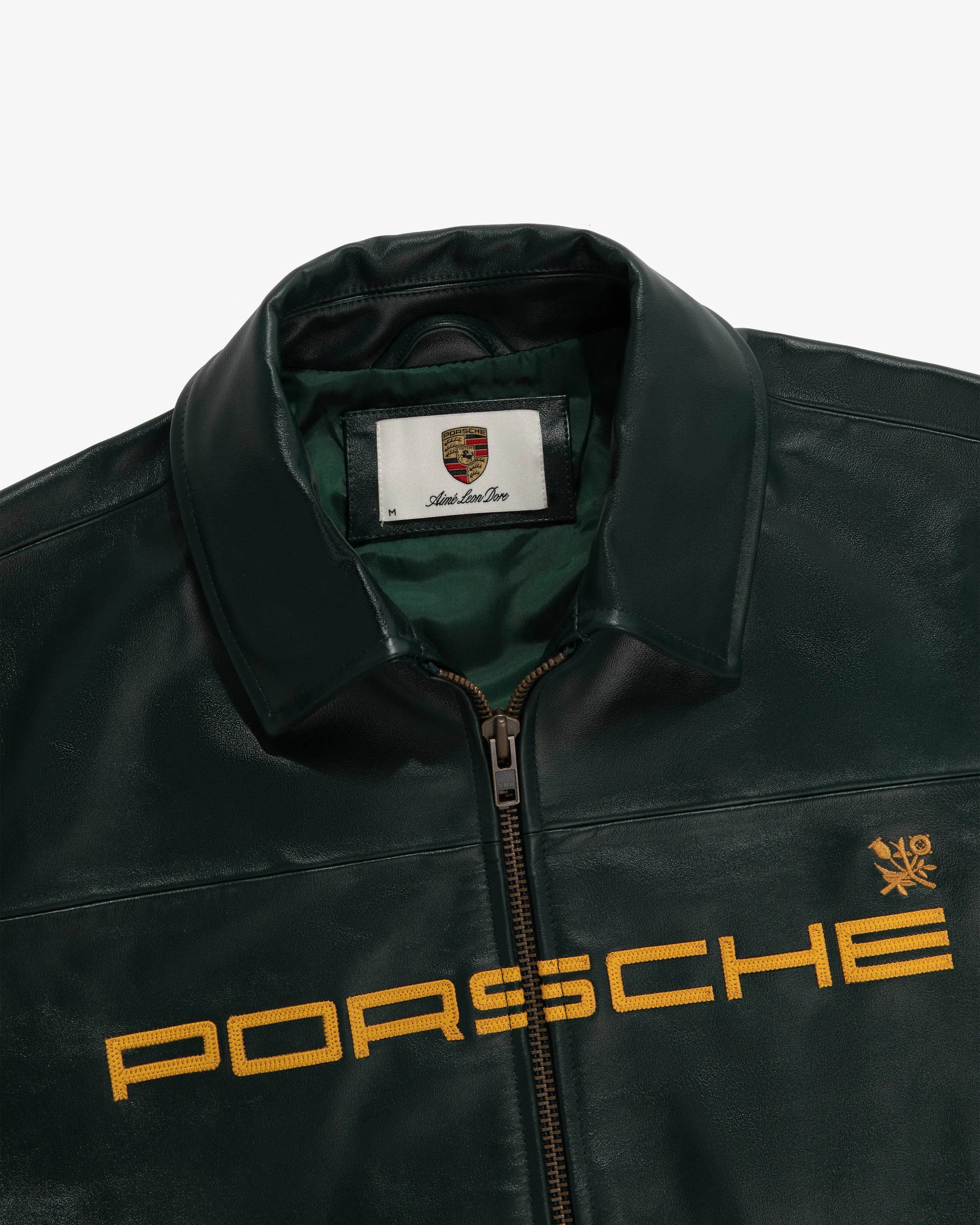 Inside lining of LZRUS Porsche 993 racing leather jacket with logo on a white background