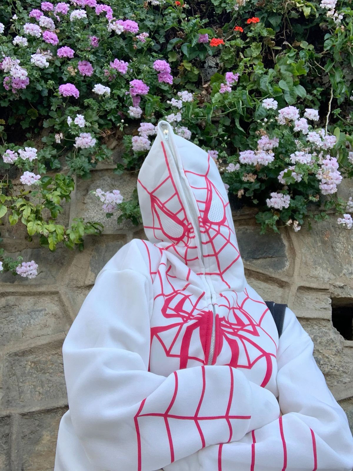 Model Wearing a  White Spider-Man Hoodie – Front View with Spider Emblem