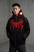 Man wearing black Spiderman embroidered hoodie with red chenille chest emblem and web embroidered sleeves, oversized streetwear India