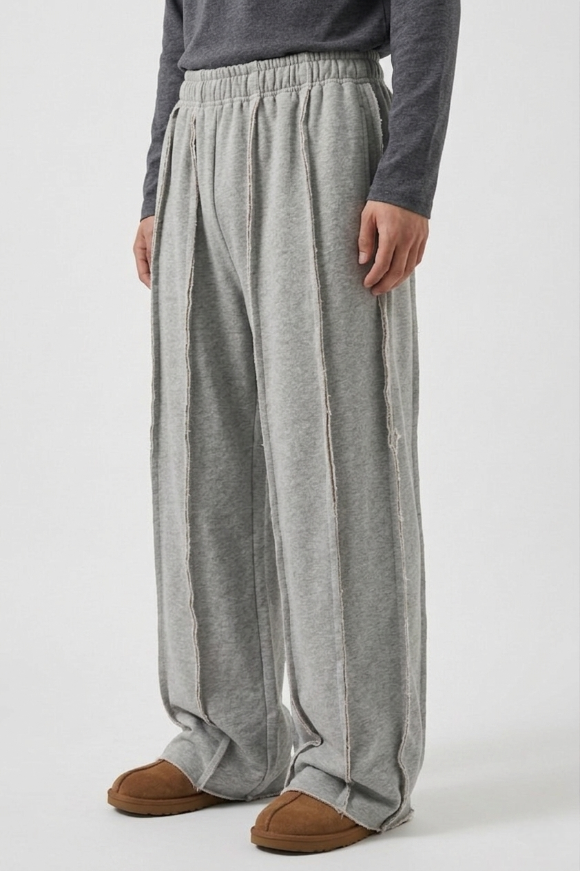 LZRUS exposed seam sweatpants men India – side angle close-up showing frayed raw edge hem and exposed outer seam detail on grey wide leg streetwear sweatpants