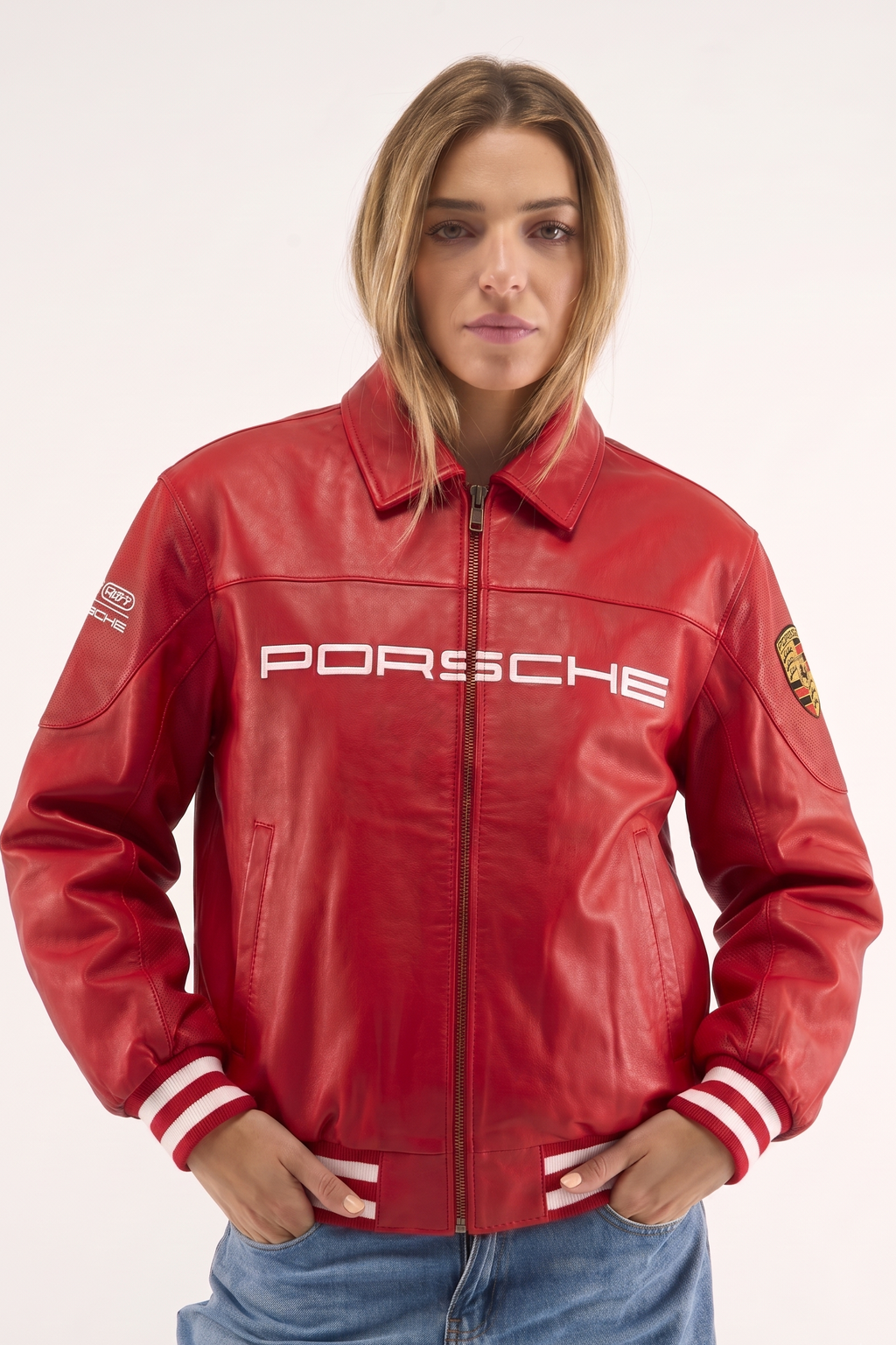 Woman wearing red Porsche leather jacket with white chest wordmark and striped cuffs – LZRUS India