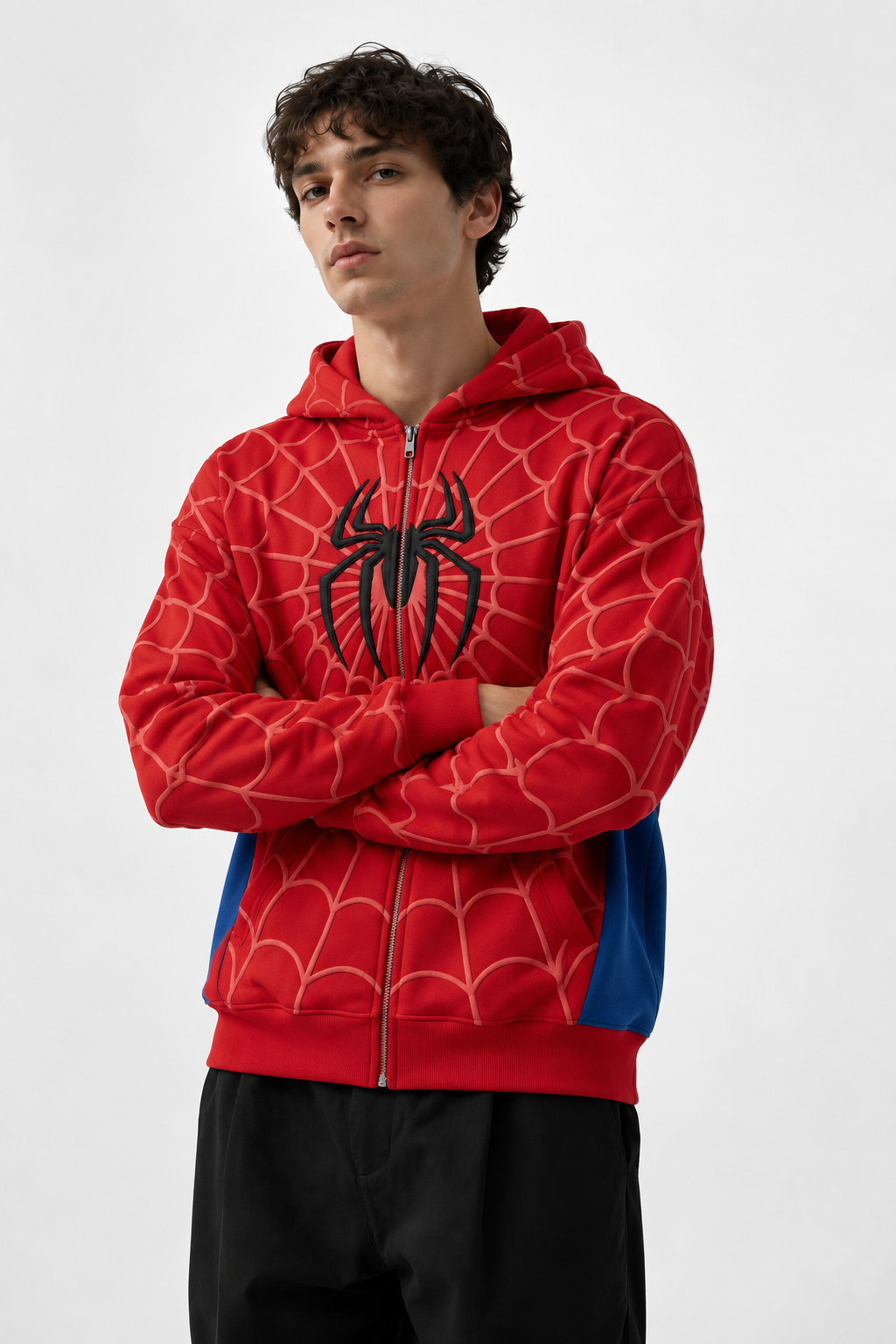 Man wearing the LZRUS spider hoodie for men in an oversized red and blue zip up fit with 3D puff print spider emblem
