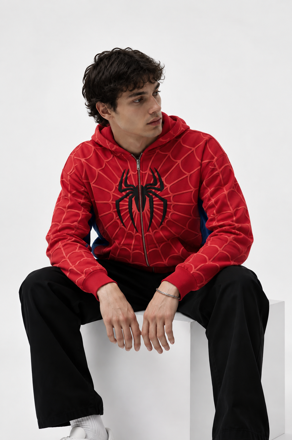 Side view of the LZRUS spider web hoodie showing the tonal web print running across the sleeve, shoulder and hood