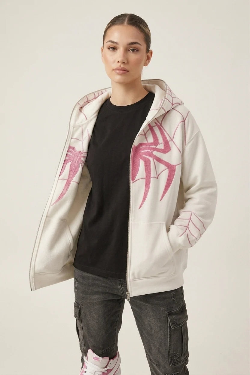 Woman wearing oversized white Spiderman embroidered hoodie with pink chenille spider, unisex zip up fit LZRUS India